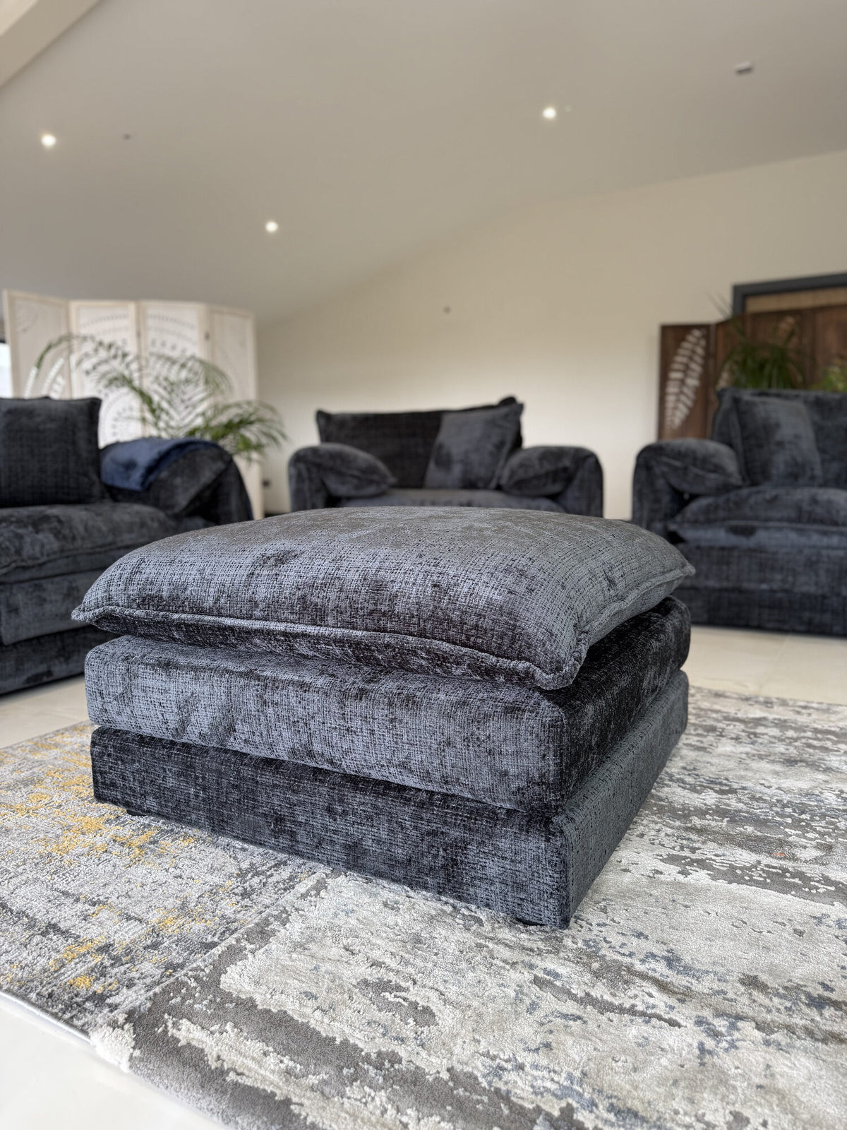 Solaya Sofa Footstool in a real home, Black